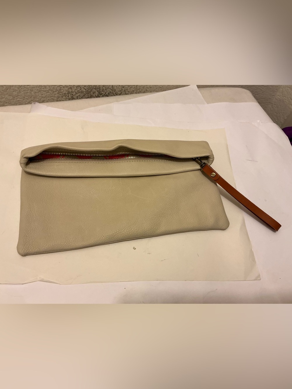 India Hicks Cream Fold-Over Leather Clutch with Red Zip Accent